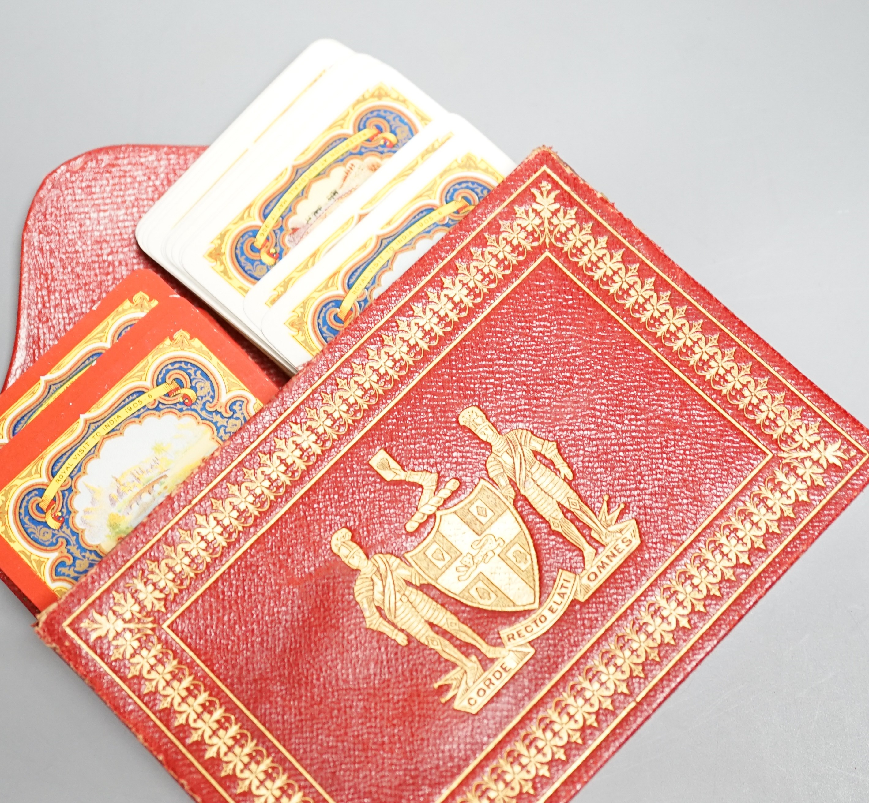 Two packs of Edwardian Royal commemorative playing cards with red morocco leather case, gilt decorated with an armorial